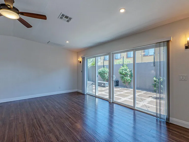 12' glass sliding doors lead you out to private rear yard.
