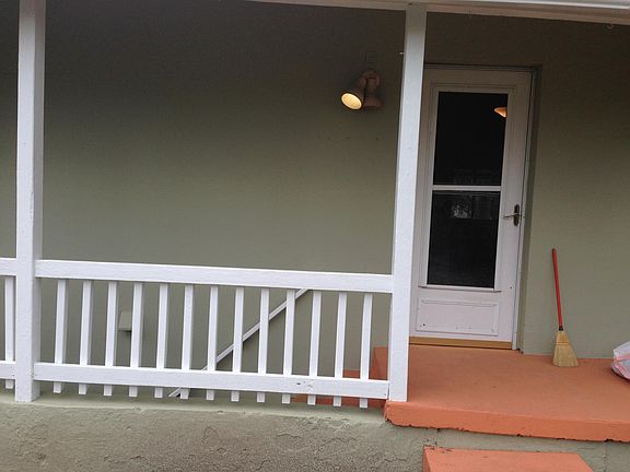 Back porch with stairs to the full basement.