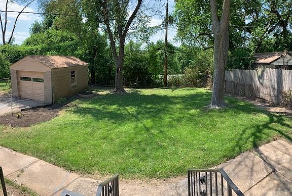 Fenced in back yard with lots of shade!