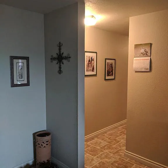 Entrance to hall to bedrooms (just past and to the right of the entrance to the kitchen).