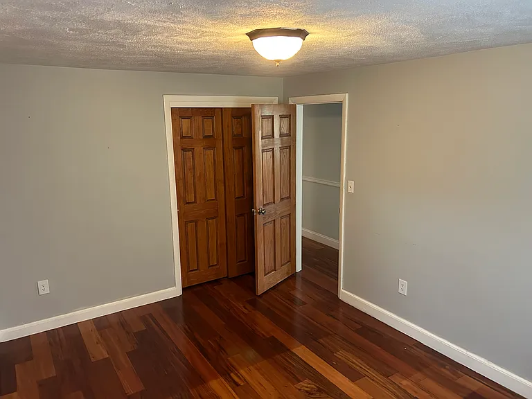 Second Bedroom with hardwood flooring.