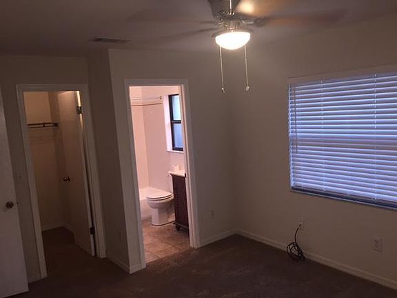 master bedroom with walk in closet and bathroom