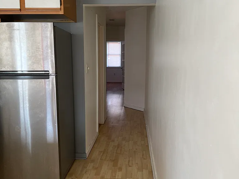 Hallway to Bedrooms, Bathroom and Front Entrance to Street