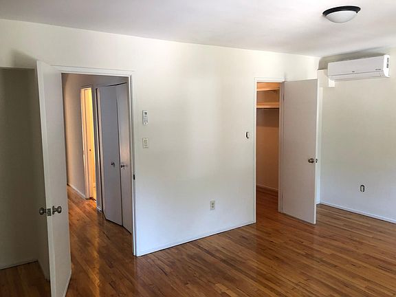 Bed room 1 on third level with walking closet and door to hallway.
