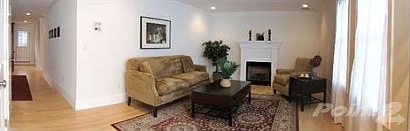 Living room to kitchen restaged panoramic