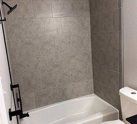 Guest bathroom with tiled walls