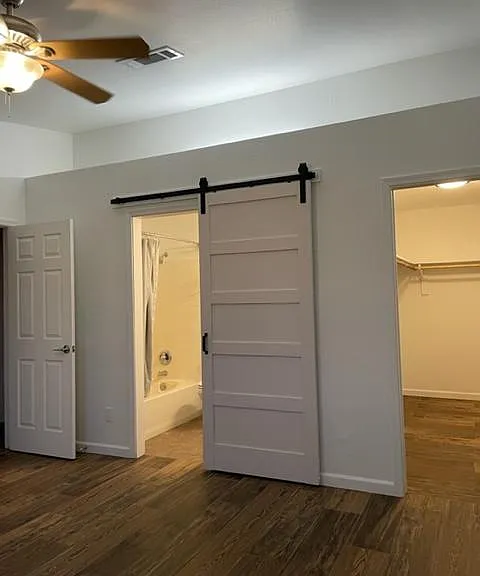 Primary bedroom bathroom and walk in closet