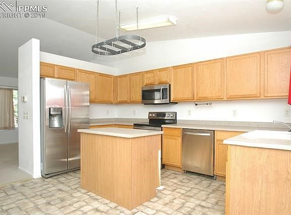 nice size kitchen with newer stainless appliances.