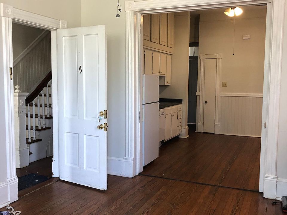 1st Floor unit A with Pocket doors Living room and kitchen. Original hardwood floors. High ceilings through out unit.