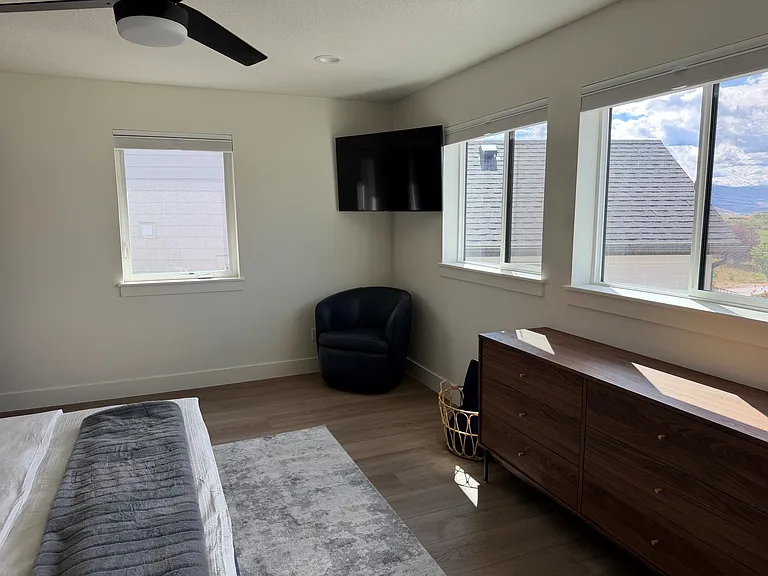 Upper level master bedroom has a TV