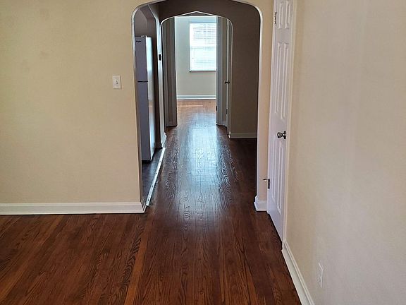 Newly refinished hardwood floors in beautiful walnut stain.
