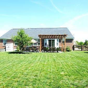 The large flat fenced back yard features an expanded covered patio. Perfect for relaxing & entertaining guests.