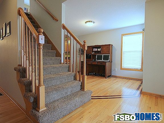 Entry Showing Office / Formal Dining Room with Inlay Accent in Hardwood Floor