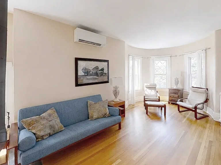 Living room pre-repairs. Available un-furnished or furnished for a higher price.