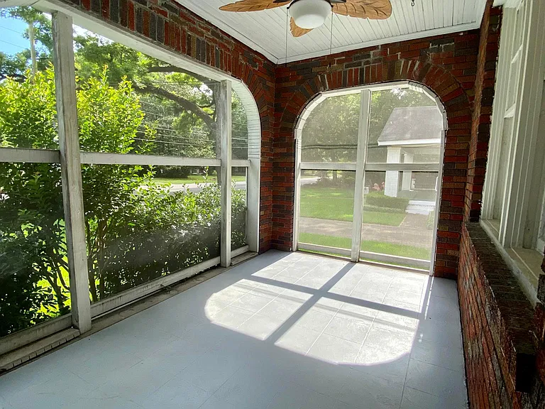 Screened in porch on front of house