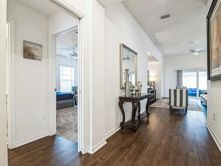 Main Entry Hallway to the House to the Open Area, Primary and Secondary Bedrooms with a Shared Bath.