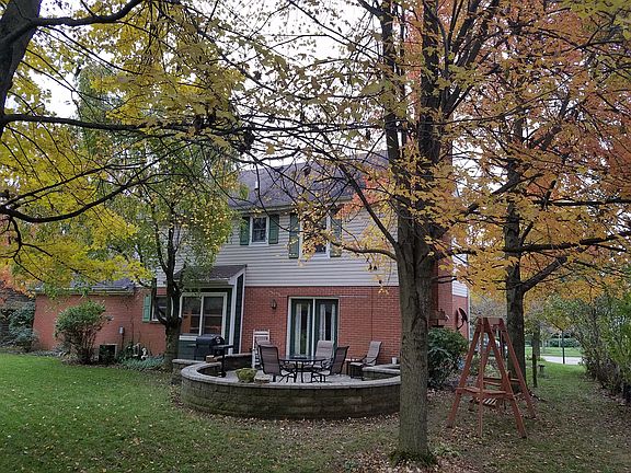Back of home, w porch, trees
