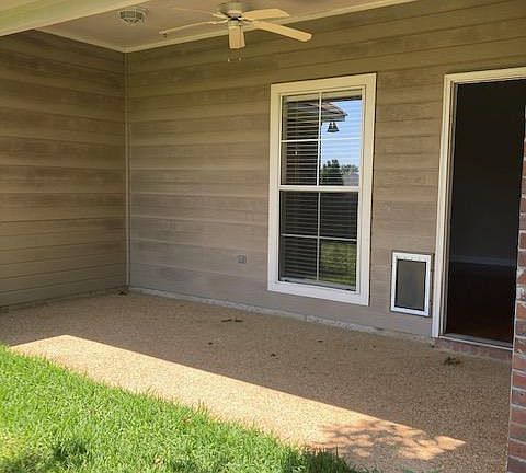 COVERED PATIO WITH FAN.