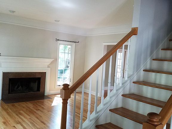 View from the front door with center stairwell and living ro