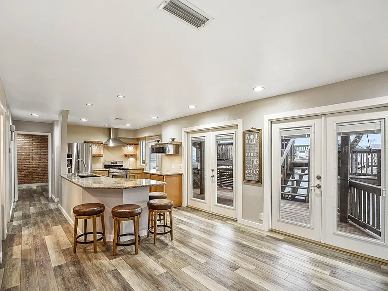 Dining Island with four leather stools.