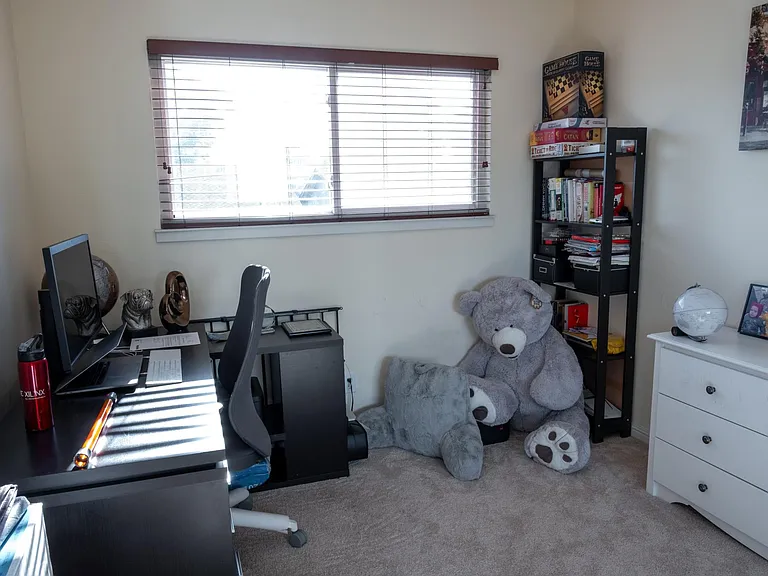 Office room/ bedroom 4 with carpets before which have now been replaced with wooden flooring
