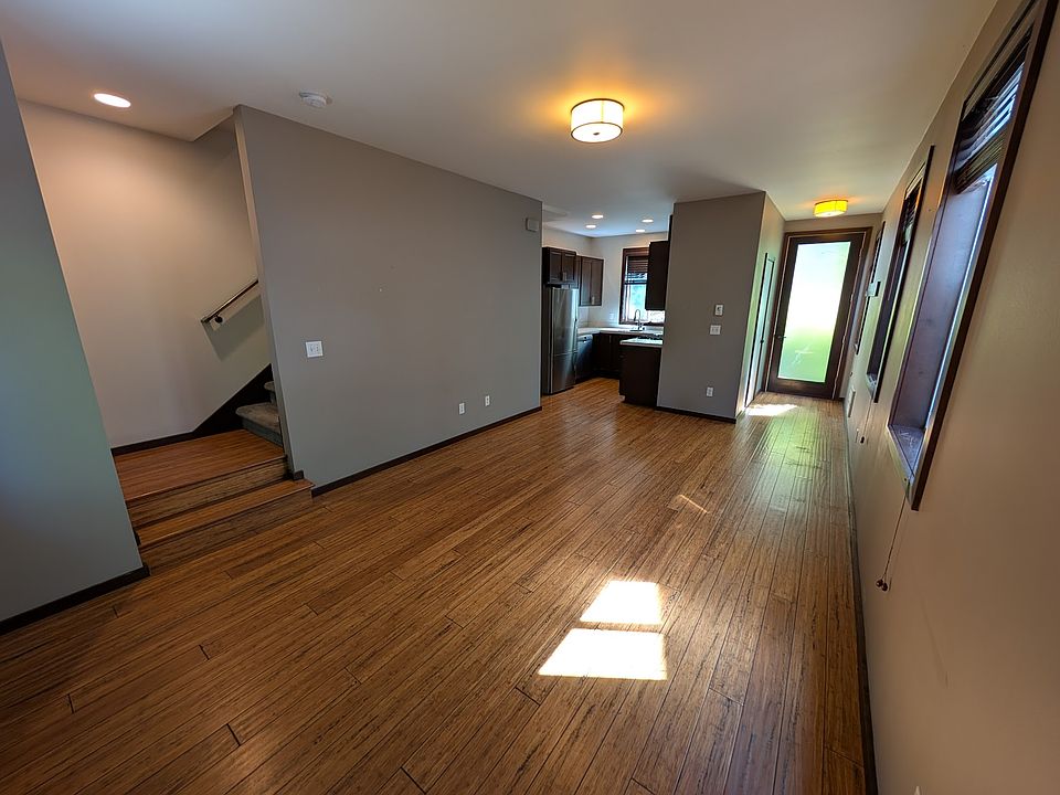 Large pantry under the stairs and half bath behind kitchen.