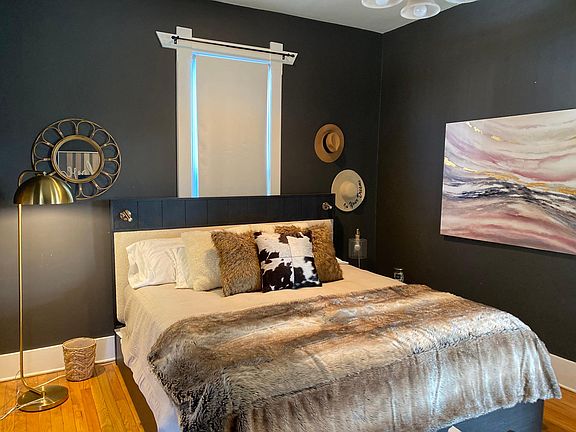 The Master bedroom is very spacious with high ceilings and stained glass picture window. Large enough for a king bed, sitting area and dresser.