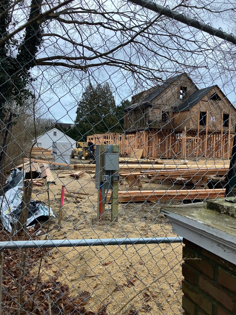 House lifted as a model and placed on new poured foundation
