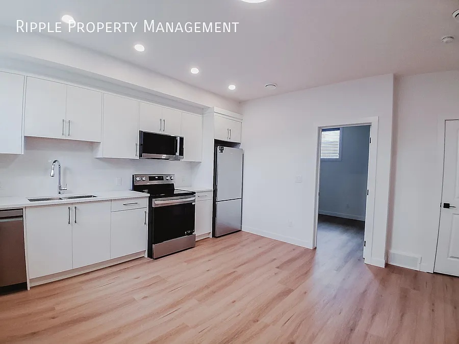 Spacious 1 Beds, 1 Baths Basement Suite | Private Rear Entry & Abundant Natural Light — Photo 3