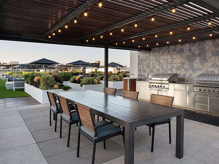 Apartment community outdoor grilling stations at Griffis East Village in San Diego, California.