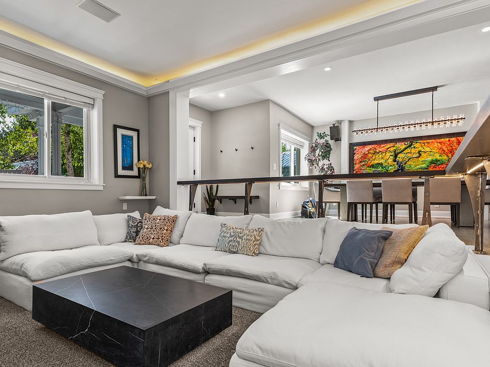 View of Living Area into Front Entrance and Dining Area
