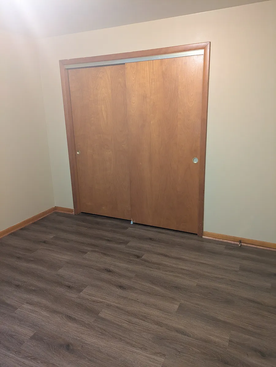 bedroom with new vinyl plank flooring - 220 S Cannon Ave #1N