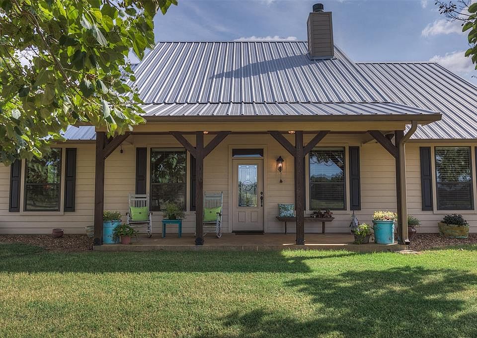 This is the front porch of the main house, where there is always a breeze! This home is located only 4 miles west of Centerville in the Redland Community.