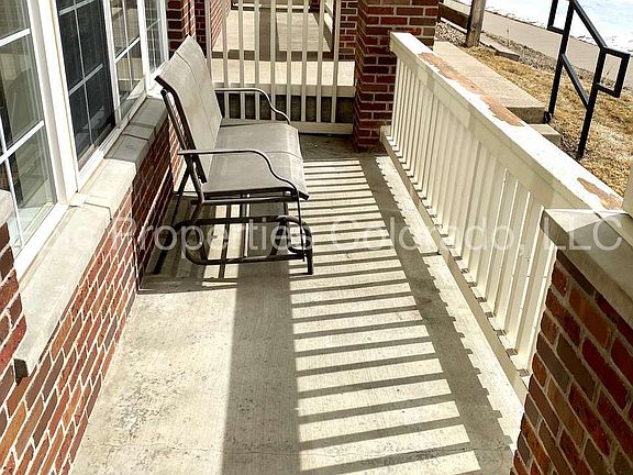 Front Patio with glider. Gas grill allowed.