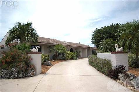 Front. Has a gate on the east side for an RV or boat. Circular Drive with privacy wall.