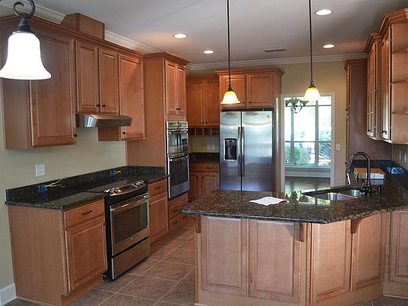 Kitchen, looking from eat in area toward front.