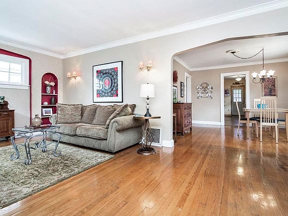 Large living room with built in's perfect for your books and collectibles.