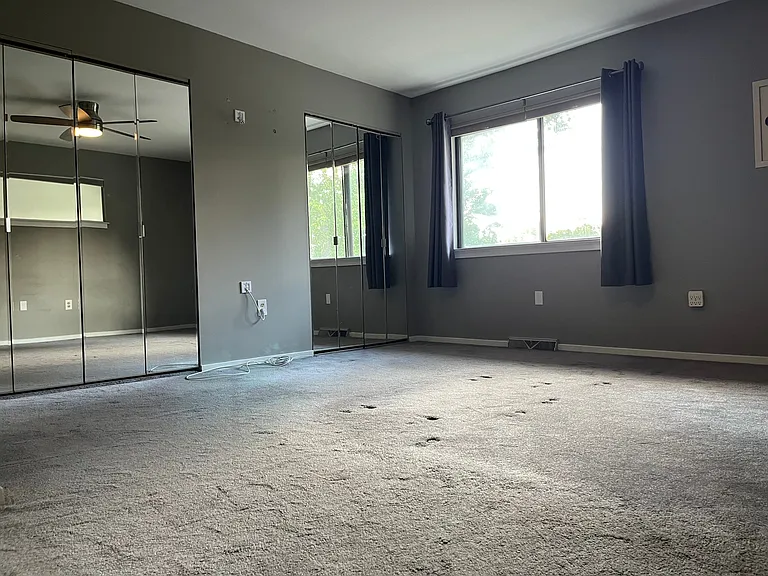 Master bedroom with two large closets and extended windows. Master bedroom has en-suite full bath.