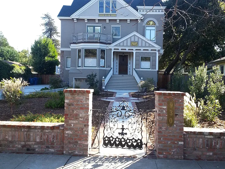 Stunning entry with charming gate. 4D tenants enter through a back door