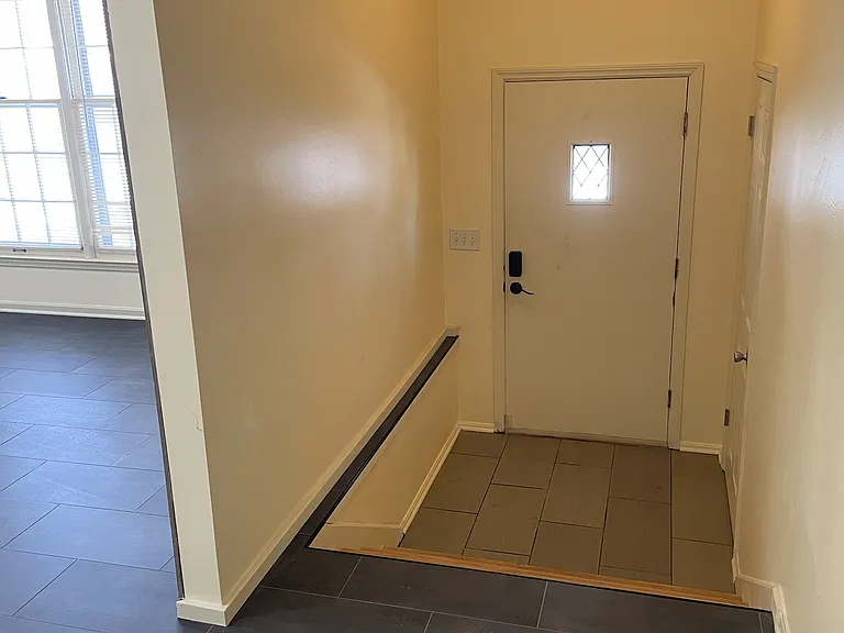 Formal entryway with coat closet.