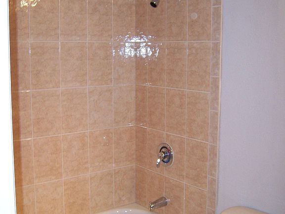 all ceramic tile in both bathrooms