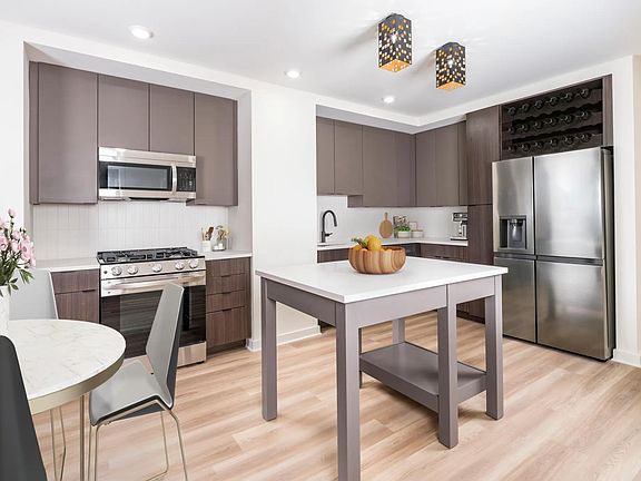 Discover your dream home at Modera Parkside! Our premium collection homes feature elegant under-cabinet kitchen lighting, distinctive fixtures, upgraded countertops, a stylish tile backsplash, and a captivating two-tone cabinet finish that elevates your l