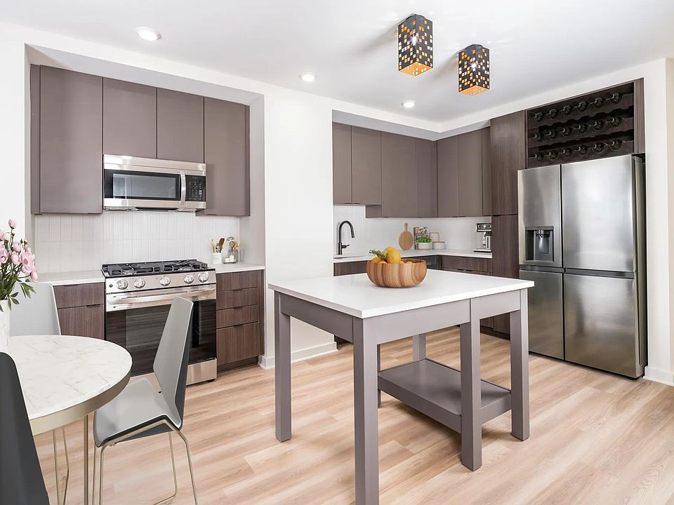 Discover your dream home at Modera Parkside! Our premium collection homes feature elegant under-cabinet kitchen lighting, distinctive fixtures, upgraded countertops, a stylish tile backsplash, and a captivating two-tone cabinet finish that elevates your l