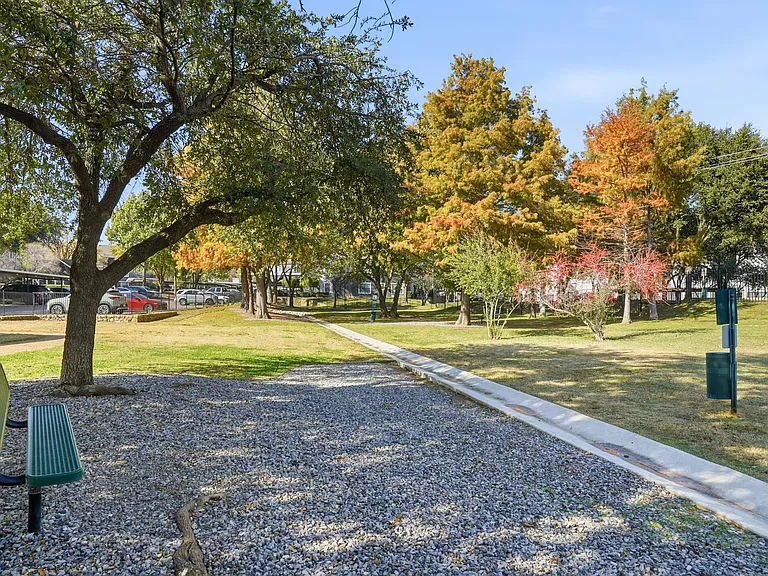 Pet-friendly space for outdoor activities with a bench and pet stations