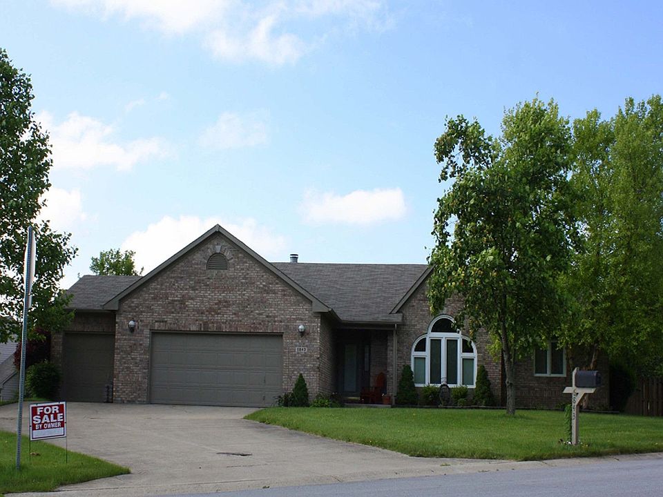 mature trees and 3 car garage