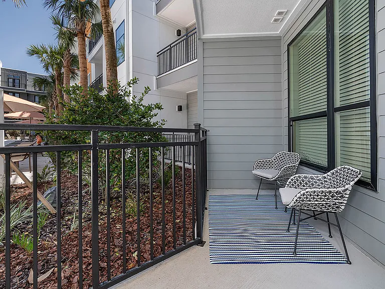 Relax in style on this beautiful balcony, perfect for enjoying the outdoors.