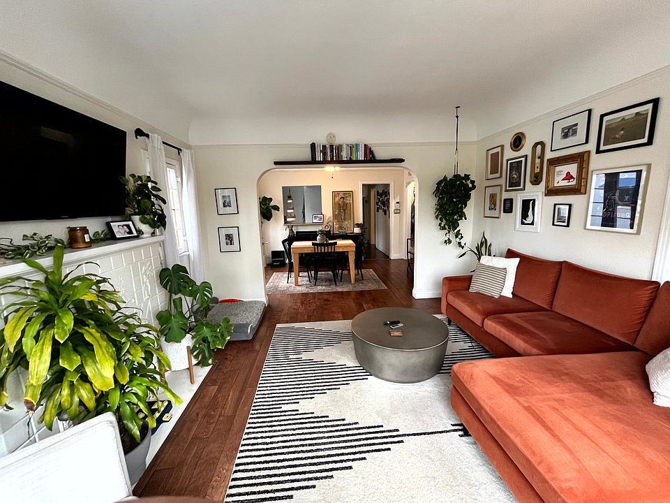 LIVING ROOM LOOKING INTO DINING AREA AND KITCHEN