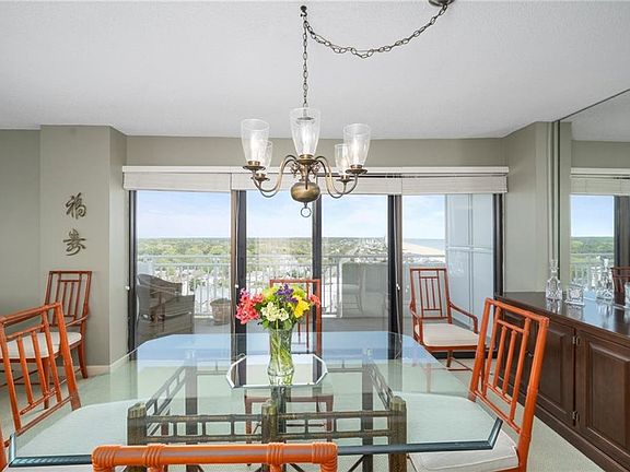 Two balconies in the unit. This is the view from the north with views of the oceanfront, Cape Henry and the Eastern Shore. 