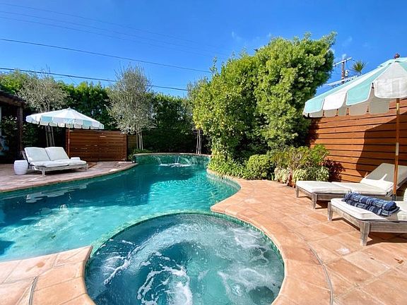 Saltwater Pool and Spa with fountain and outdoor fireplace