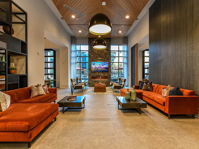 The clubroom features lounge seating and large-screen TV.